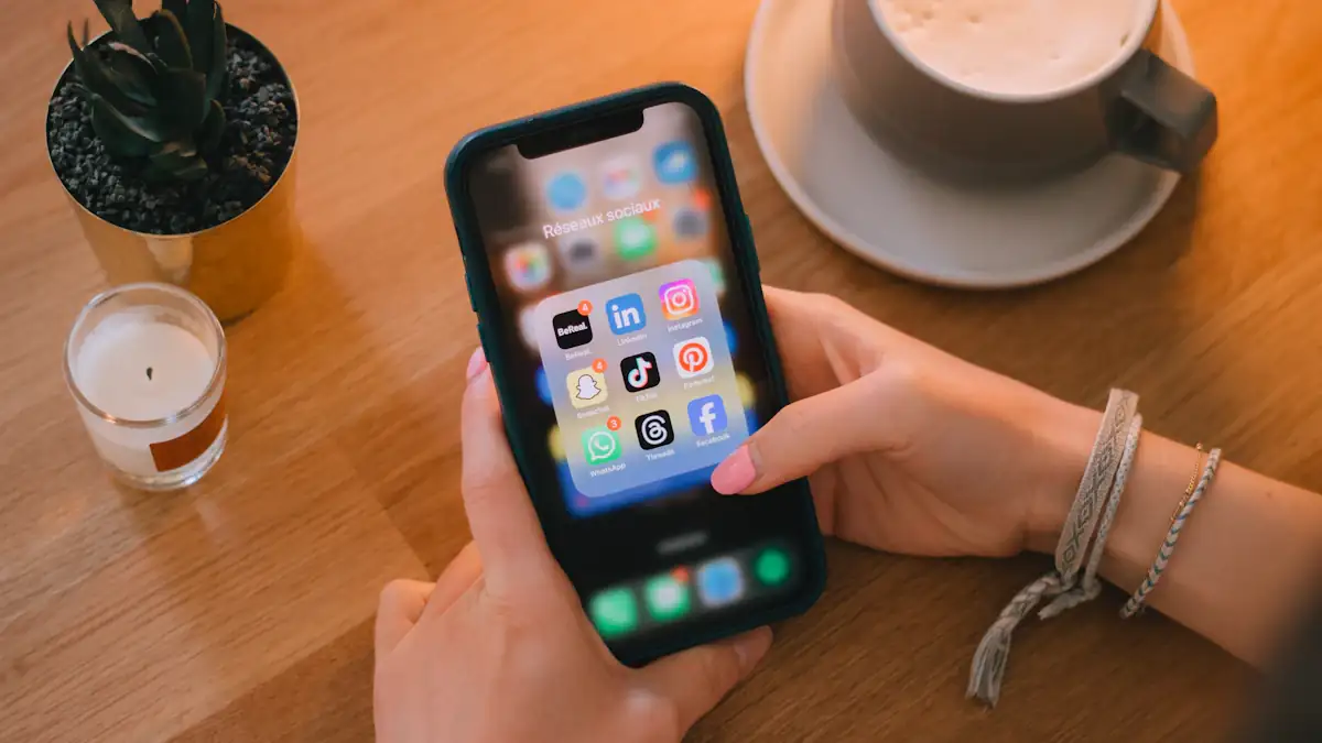 Phone with social apps on a table next to a coffee